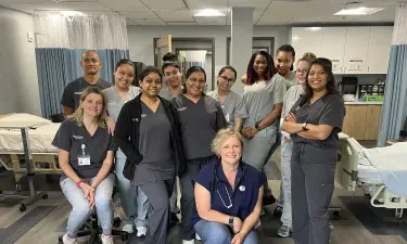 Group of Herzing Brookfield nursing students participating in laboratory simulation experience 